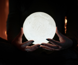 crystal ball held by two hands