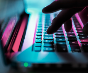 fingers typing on a keyboard