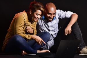 woman and man looking at computer screen