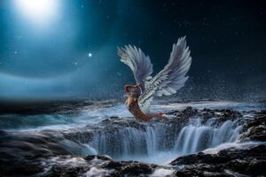 angel flying over the sea