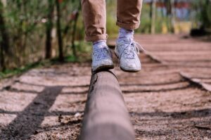 balancing on a piece of log