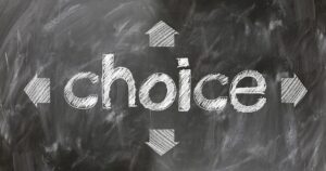 The word "choice" is written in chalk on a blackboard, surrounded by arrows pointing up, down, left, and right