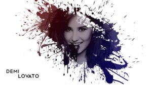 artistic depiction of Demi Lovato's face emerging from a splash of red and blue paint