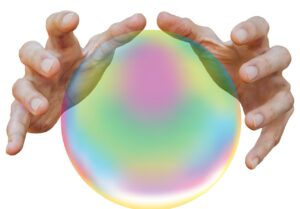 hands shielding a crystal ball