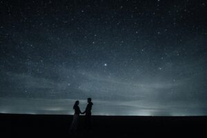 couple hugging under the night sky