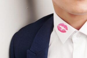 a lipstick mark or kiss mark on a shirt collar.