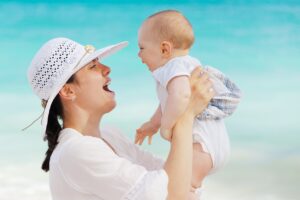 woman looking happy with her baby