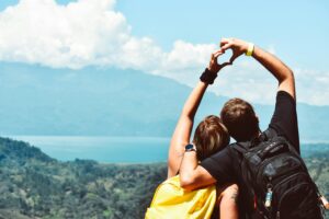 two people forming heart