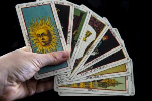 hand holding tarot cards