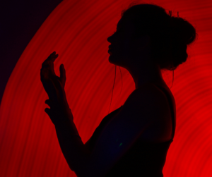 silhouette of a lady with red background