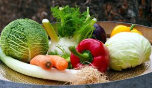A variety of fresh vegetables on a platter.